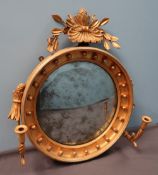 A Victorian gilt gesso girandole of circular form with a shell,