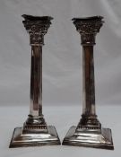 A pair of George VI silver candlesticks,