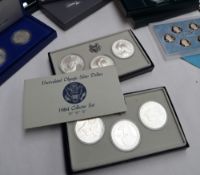 A set of three Los Angeles silver dollars dated 1983 for the 1984 Olympics,