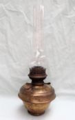 Railwayana - A brass oil lamp, with a ribbed body and glass funnel,
