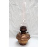 Railwayana - A brass oil lamp, with a ribbed body and glass funnel,