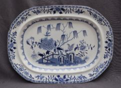 A 19th century blue and white pottery meat plate, decorated in the elephant and rock pattern,