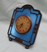 A George V silver and blue enamel decorated desk clock,