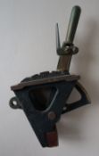 A bronze mini power box lever, with a spring loaded handle and four divisions, impressed F230,