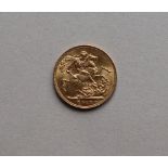 A George V gold sovereign,