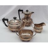 A George V silver four piece tea set comprising a teapot, hot water jug,