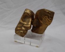 A limited edition gilt bronze statue of two faces, No.