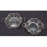 A matched pair of George V silver twin handled bon bon dishes, of pierced lobed shape, Birmingham,
