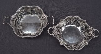 A matched pair of George V silver twin handled bon bon dishes, of pierced lobed shape, Birmingham,