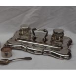 A late Victorian silver desk standish, of shaped rectangular form,