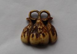 A 19th century carved antler netsuke, in the form of fruit,