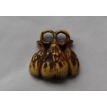 A 19th century carved antler netsuke, in the form of fruit,