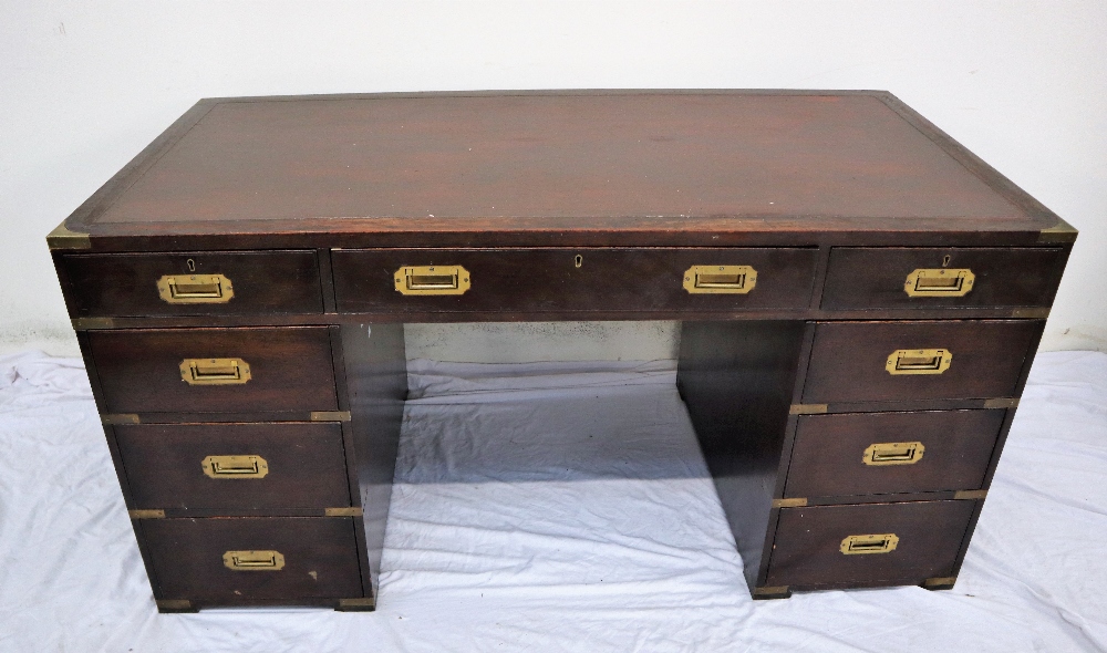 A 19th century mahogany campaign desk, the rectangular brass bound inset top above three drawers,