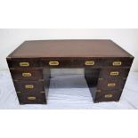 A 19th century mahogany campaign desk, the rectangular brass bound inset top above three drawers,