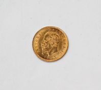 An 1863 Gold 5 Lira coin