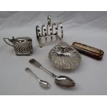 A George VI silver four division toast rack, Sheffield, 1944 together with a silver mustard pot,