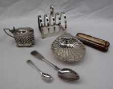 A George VI silver four division toast rack, Sheffield, 1944 together with a silver mustard pot,