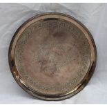A George III silver waiter of circular form, with a line rim,