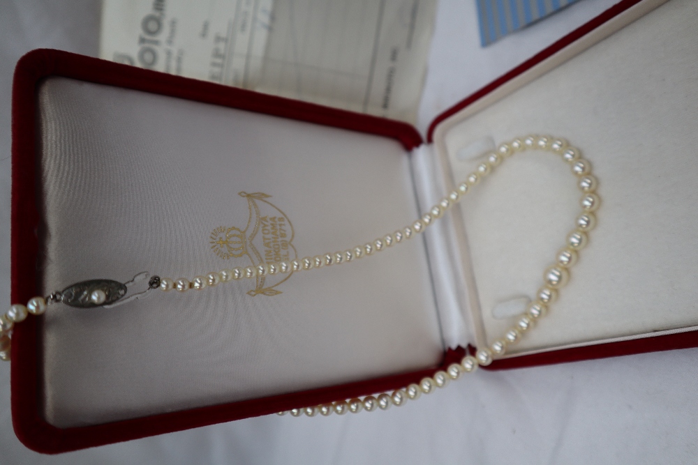 A Mikimoto pearl pendant on a 14ct gold suspension loop on a yellow metal chain, - Image 4 of 5