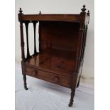 A Victorian rosewood whatnot, with a rectangular top and turned finials,