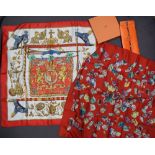 A Hermes silk scarf, Mineraux, in a pouch together with another Hermes scarf,