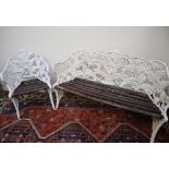 A cast iron Coalbrookdale style garden two seater bench and matching chair,
