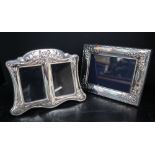 A modern silver photograph frame, of rectangular form, embossed with swags, flowers and leaves,