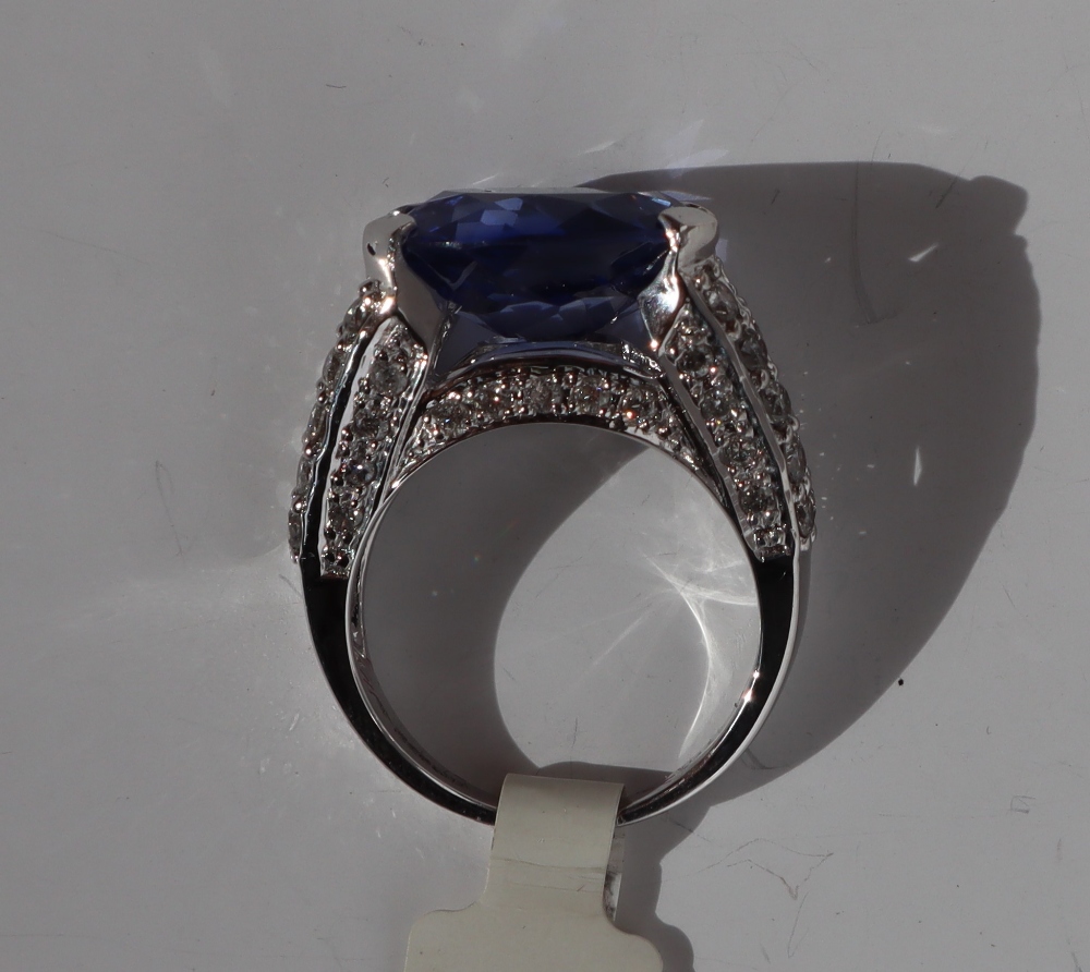 A sapphire and diamond ring, the oval faceted sapphire 14mm x 7mm, - Image 3 of 4