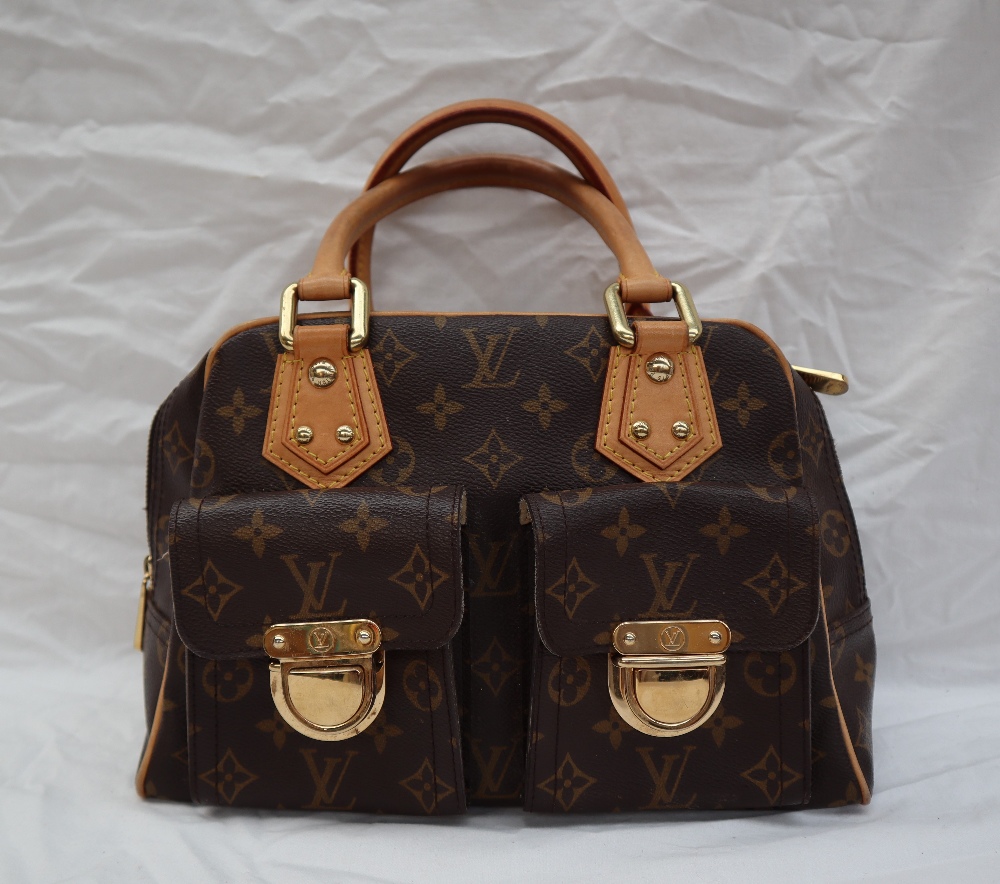 A Louis Vuitton monogram handbag, with leather handles,