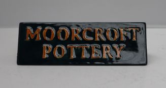 A Moorcroft pottery name plaque, of triangular form, decorated in the Mayfly pattern, dated 2004,