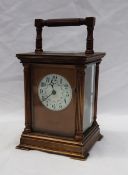 A 20th century brass cased carriage clock, the case with four Ionic columns,