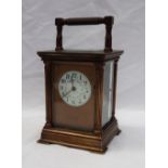 A 20th century brass cased carriage clock, the case with four Ionic columns,