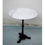 A garden table, the circular white marble top on a cast iron column and tripod base,