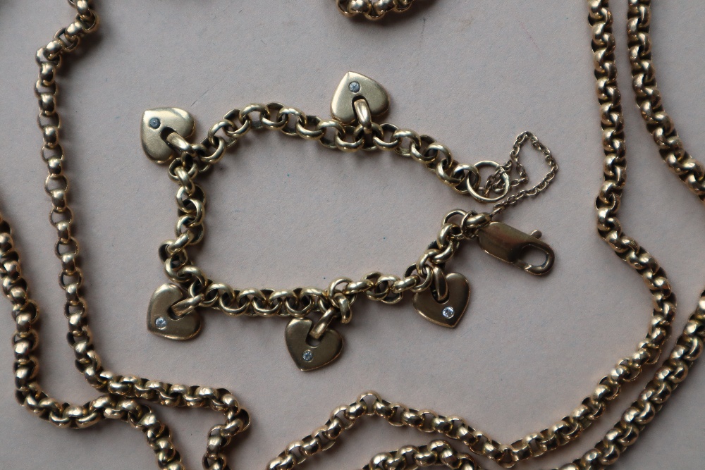 A 9ct yellow gold necklace and a 9ct gold bracelet with heart shaped charms,