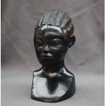 An African carved ebony head and shoulders of a maiden,