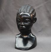 An African carved ebony head and shoulders of a maiden,