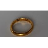 A 22ct yellow gold wedding band, size Z, approximately 8.