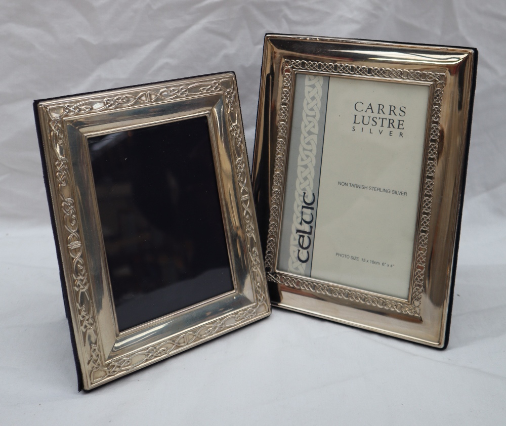 A modern silver photograph frame, of rectangular form with a Celtic pattern,