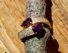 An amethyst and diamond set ring,