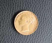 A Victorian gold young head shield back sovereign,
