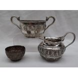 An Indian white metal twin handled sugar basin, with serpent handles,
