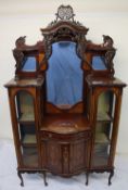 An Edwardian mahogany chiffonier, with a shaped back and three mirrors with shelves,