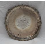 A George IV silver salver, with a shell gadrooned edge,