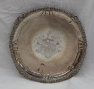 A George IV silver salver, with a shell gadrooned edge,