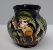 A Moorcroft pottery vase, with a flared rim, decorated in the Kirindi pattern,