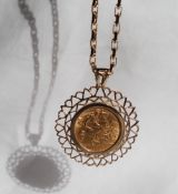 A George V gold half Sovereign, dated 1912, in a 9ct yellow gold setting and chain,