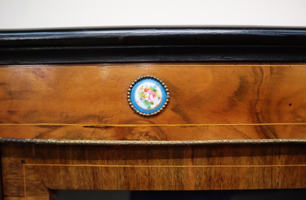 A Victorian walnut credenza the breakfront top with ebonised edge above a central cupboard and two - Image 7 of 16