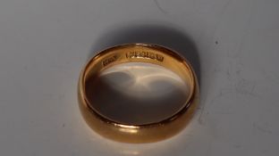 A 22ct yellow gold wedding band, size L 1/2,