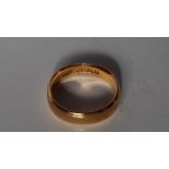 A 22ct yellow gold wedding band, size L 1/2,