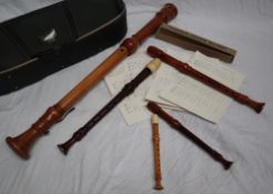 A Dolmetsch Bass recorder together with a collection of Dolmetsch recorders,